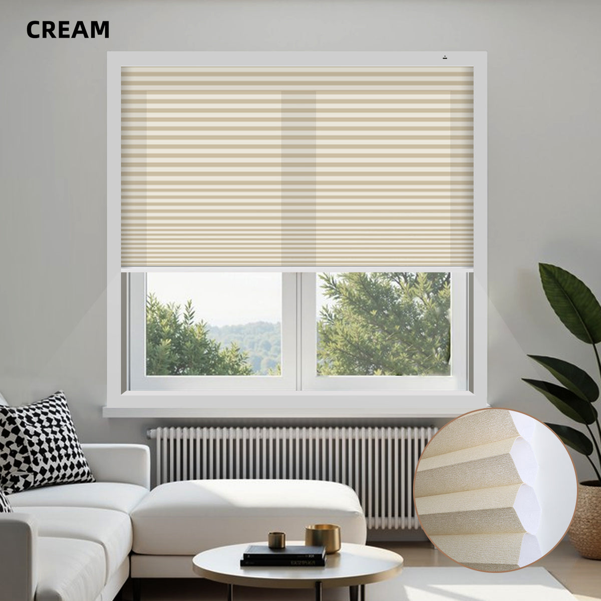 Living room with cream window energy efficient cellular shades, white sofa, and decorative items.