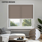Coffee brown blinds in a window with a modern living room setup