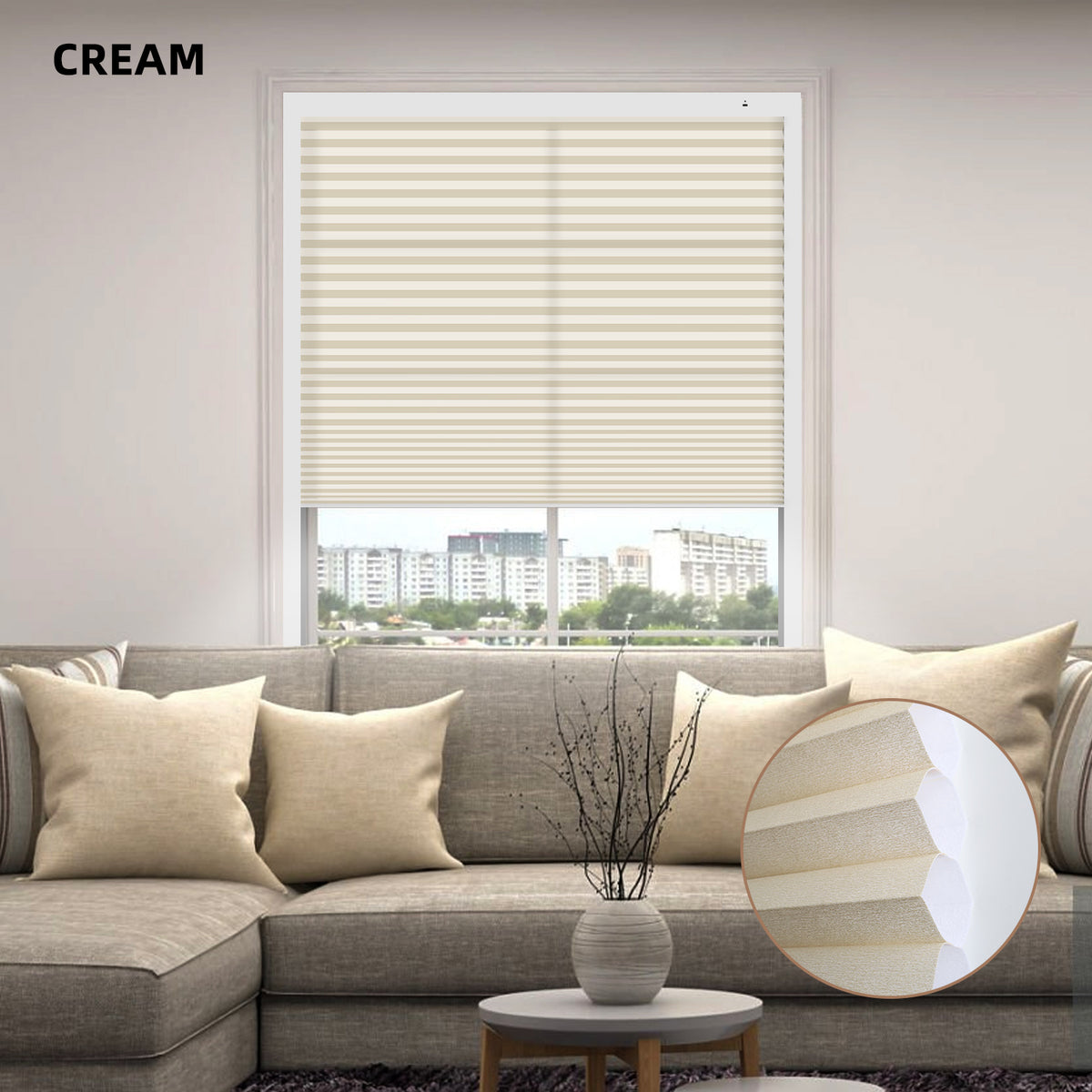 Living room with cream-colored motorized cellular honeycomb shades, sofa, and decor elements.