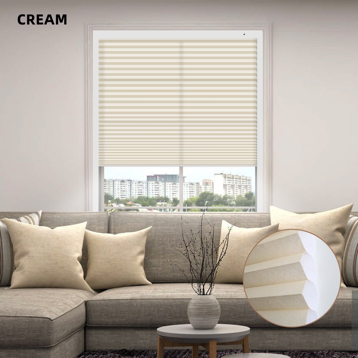 Living room with cream-colored motorized cellular honeycomb shades, sofa, and decor elements.