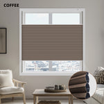 Living room with a window featuring a brown pleated honeycomb blind, 'COFFEE' text above.
