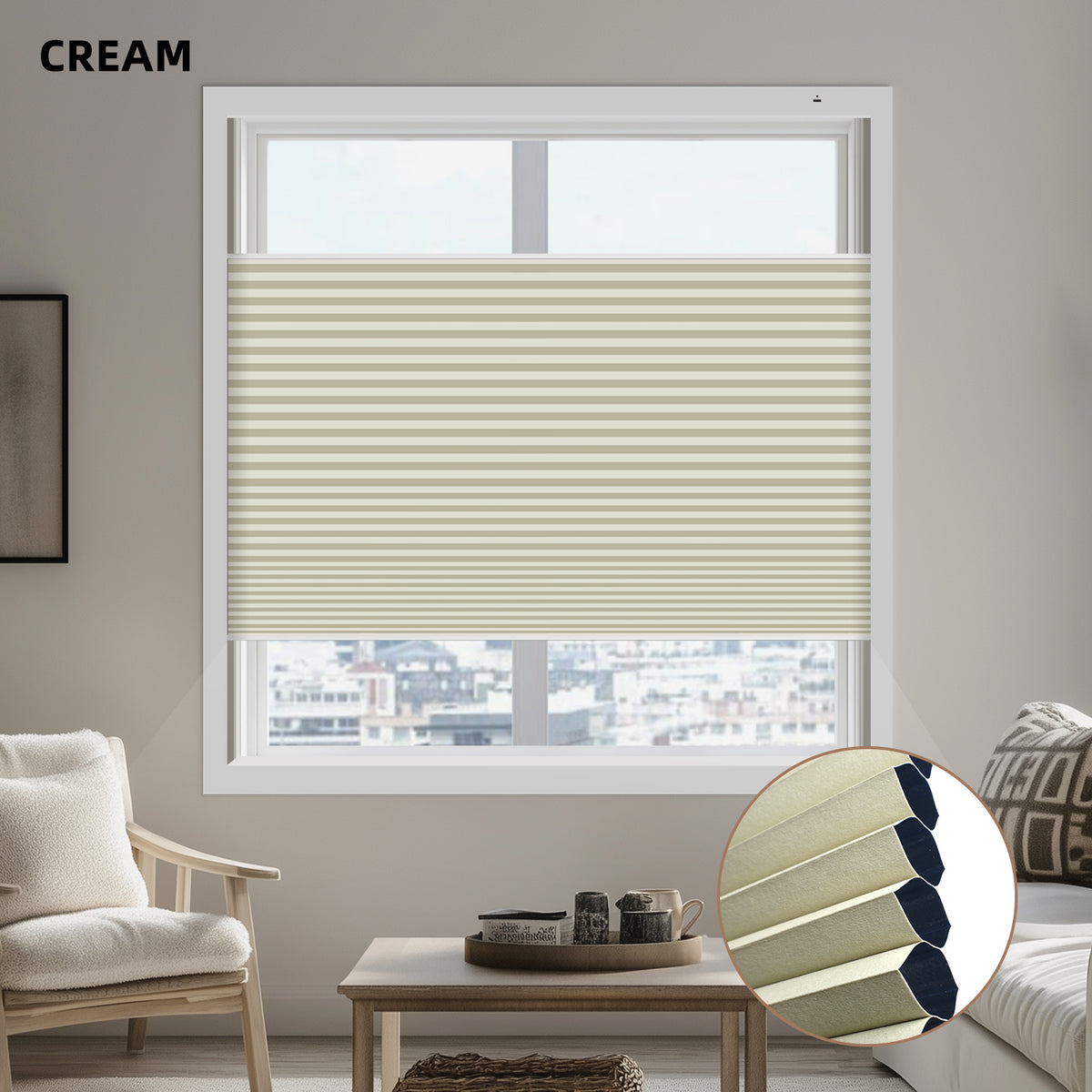Living room with a window featuring cream-colored blackout cellular shades.